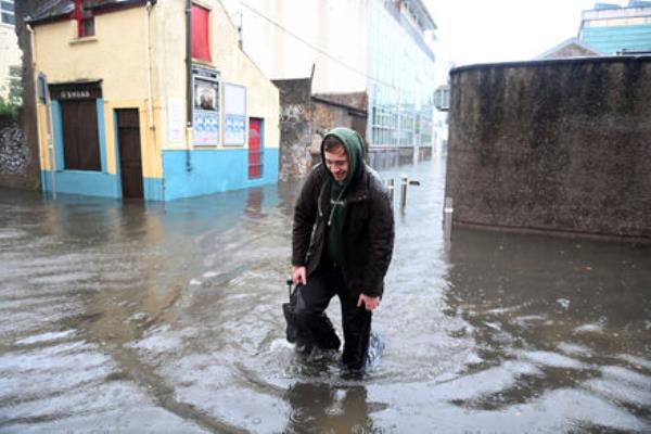 While the worst of the flooding was in East Cork, other areas were affected too. Here, a pedestrian makes his way through floodwaters on Rutland St off South Terrace in Cork City during Storm Babet on Wednesday morning. Picture: Larry Cummins While the worst of the flooding was in East Cork, other areas were affected too. Here, a pedestrian makes his way through floodwaters on Rutland St off South Terrace in Cork City during Storm Babet on Wednesday morning. Picture: Larry Cummins