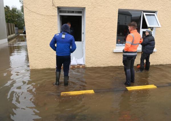 People assessing the damage and clearing up after the Storm Babet flooding in Rathcormac, Co Cork on Wednesday. Picture; Eddie O'Hare People assessing the damage and clearing up after the Storm Babet flooding in Rathcormac, Co Cork on Wednesday. Picture; Eddie O'Hare