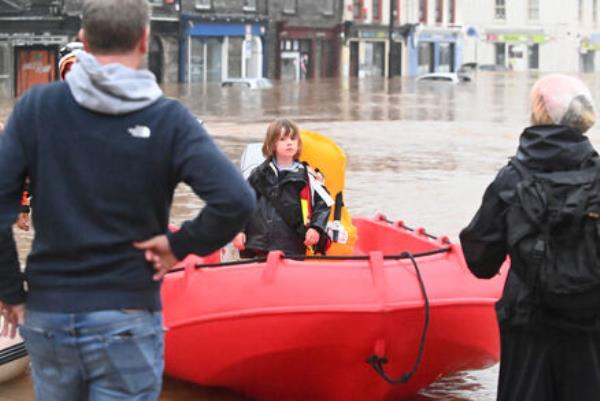 Dinghies had to be used to bring people to dry ground in Midleton, Co Cork, in the aftermath of the Storm Babet flooding on Wednesday. Picture: Eddie O'Hare Dinghies had to be used to bring people to dry ground in Midleton, Co Cork, in the aftermath of the Storm Babet flooding on Wednesday. Picture: Eddie O'Hare
